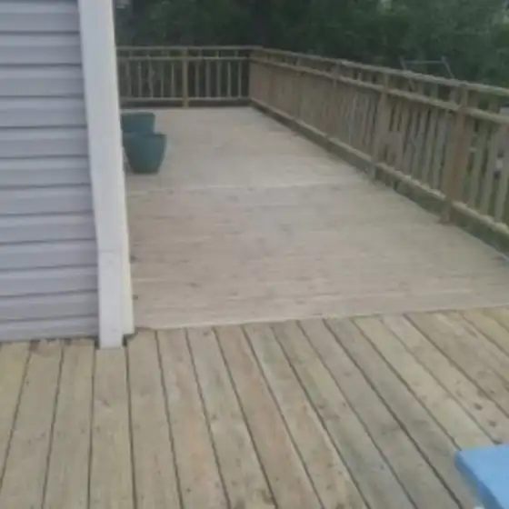New treated deck boards partway through the job