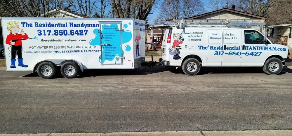 White van towing a white hot water pressure washing trailer lettered with the phone number 317.850.6427
